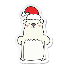 sticker of a cartoon bear wearing christmas hat