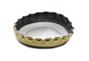 Golden bottle cap for beer isolated on white