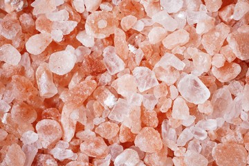 Himalayan pink salt background, selective focus