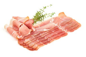 Folded jamon or ham slice, close-up, isolated on white background