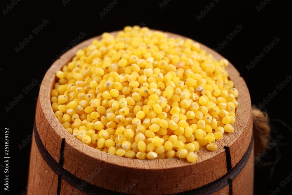 Canvas Prints Barrel with millet on a black background closeup