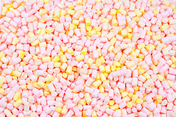 Marshmallow. Background of pink and yellow colorful mini marshmallows.