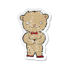 retro distressed sticker of a cartoon teddy bear