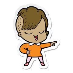 sticker of a happy cartoon girl pointing