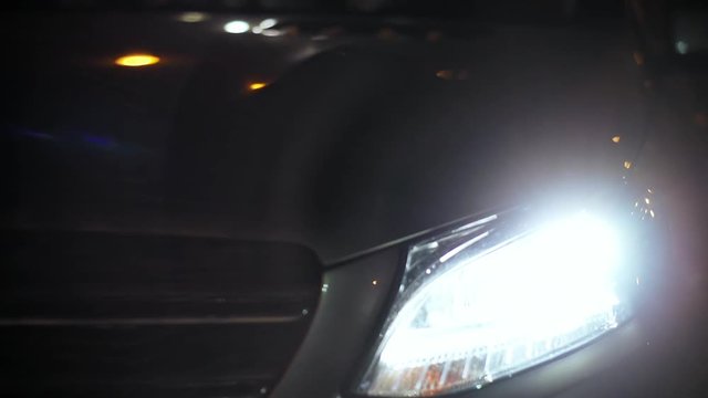 Front View Of A Car With Three Friends Sitting Inside Talking And Waiting At Night. Close-up Of A Car.