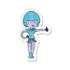 retro distressed sticker of a cartoon vampire girl giving thumbs up sign
