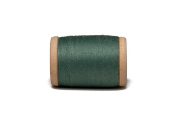 Wooden coil with thread on a white isolated background