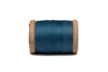 Wooden coil with thread on a white isolated background