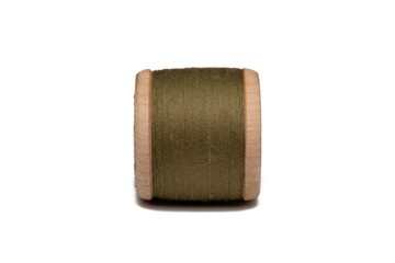 Wooden coil with thread on a white isolated background