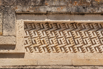 Elaborate fretwork found in old ruins in Oaxaca, Mexico. Stone detail found in the archeological site of Mitla