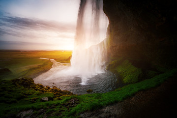 Perfect view of famous powerful Seljalandsfoss waterfall in sunlight. Location place Iceland, sightseeing Europe.