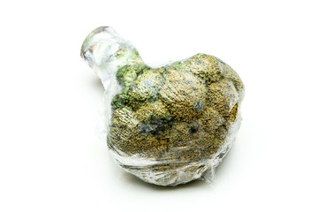 A picture of a rotten broccoli packed in the plastic foil. The foil is useless, it only damages the...