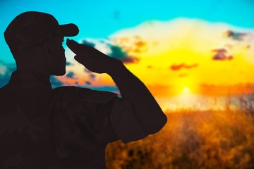 Young military soldier man silhouette on background