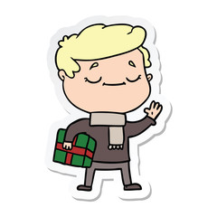 sticker of a cartoon man carrying christmas present waving
