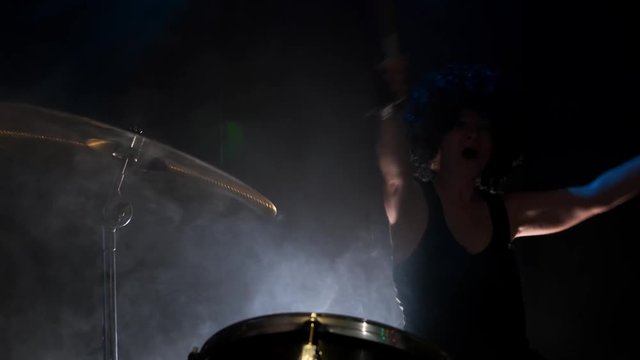 end performance of musician by drumroll on drum plate.
