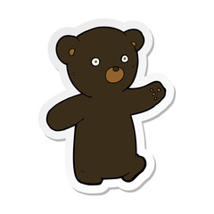 sticker of a cartoon black bear cub