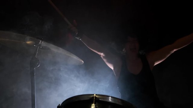 end performance of musician by drumroll on drum plate.