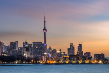 Fototapeta premium The Toronto skyline at sunrise, as seen from one of the cities newest parks, Trillium Park. 