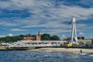 view of the Ustka coast and drawbridge, buildings and beach