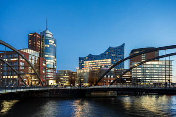 Obraz na płótnie Canvas Modern brick buildings in the Speicherstadt of Hamburg directly on the Elbe and the Zollkanal