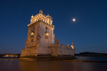 Obraz premium Belém Tower (Torre de Belém) a mediaeval portuguese fortification from the 16th century in Lisbon during blue hour. Portugal tourism and destination