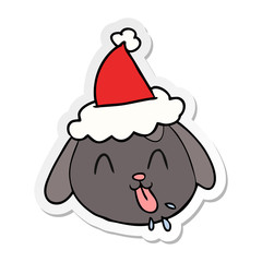 sticker cartoon of a dog face wearing santa hat