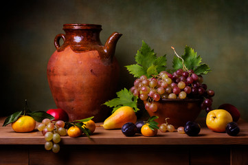 Still life with grapes, pears and plums