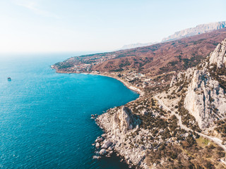 Aerial view from drone of beautiful mountain rocks and sea landscape in Simeiz, Crimea. Amazing tropical nature with coast, seascape and mountains
