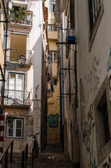 Old traditional street in the historic center of Lisbon, Portugal