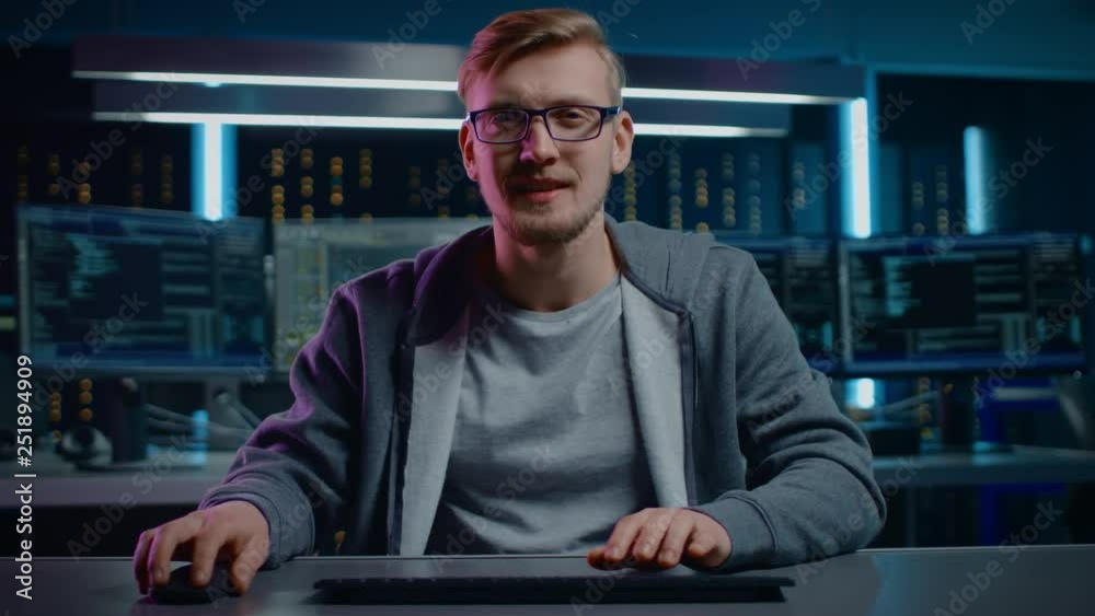 Aufkleber Portrait of Software Developer / Hacker Wearing Glasses Sitting at His Desk and Working on Computer in Digital Identity Cyber Security Data Center. Hacking or Programming. POV Camera Shot