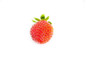 One red strawberry with leaves on white background