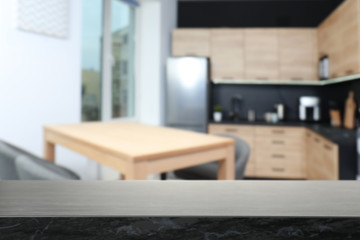 Empty table in modern kitchen. Mockup for design