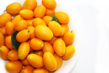 Small oranges on the white background. Nature fruits background.