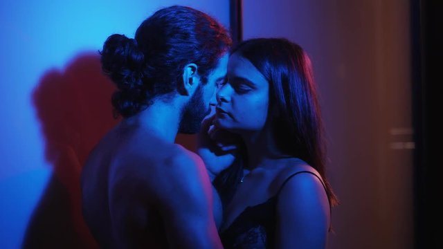 Attraction,sex, sensuality: Young Hot Couple Kissing Passionately in the dark. 