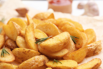 Closeup view of delicious baked potato wedges