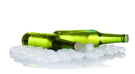 Bottles of beer and ice cubes on white background