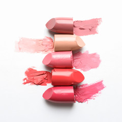 Different lipstick swatches on white background, top view - obrazy, fototapety, plakaty