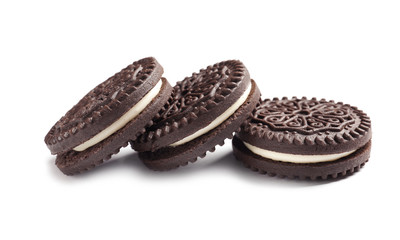 Tasty chocolate cookies with cream on white background