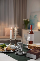 Table served for Passover (Pesach) Seder indoors, space for text