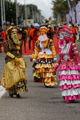 Fototapeta na wymiar Les belles touloulous : une tradition guyanaise à la parade du littoral de Kourou en Guyane française