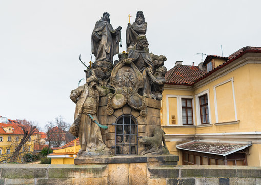 Prague, Czech Republic. Statues of Saints John of Matha, Felix of Valois, and Ivan on the Charles Bridge. The sculpture was designed in 1714. The base depicts a cave in which three chained Christians 