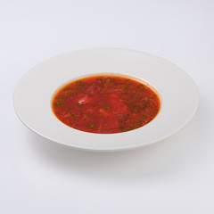 Ukrainian and russian national red borsch isolated on white background.