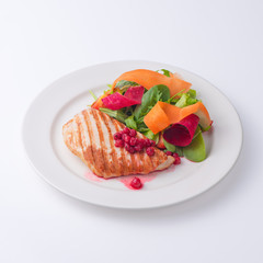 Chicken fillet steak with salad  and white sauce. 