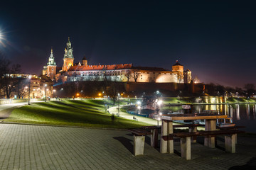 Fototapeta na wymiar Wawel hill with royal castle at night. Krakow is one of the most famous landmark in Poland