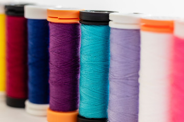 close-up on sewing thread spools