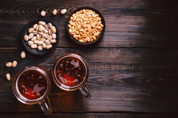 beer and snacks. bar table. restaurant, pub, oktoberfest food. delicious lager drink and salted nuts. friday party atmosphere, craft brewery concept