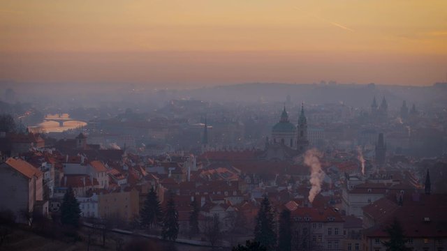 A beautiful view of Prague at sunrise on a misty fog morning.