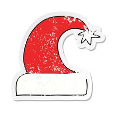 retro distressed sticker of a cartoon christmas hat