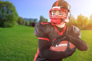 Young american football player in team uniform