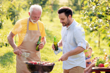 Father and son make barbecue